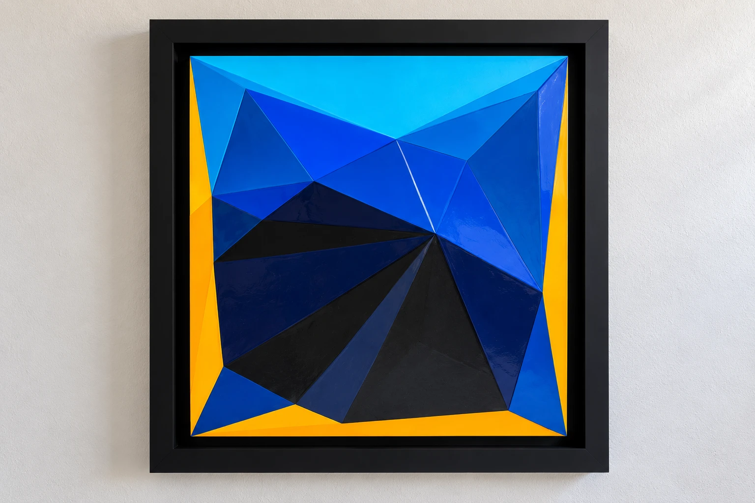 Front view of Shallow Relief and Saturation, with blue and yellow geometric facets in a black frame