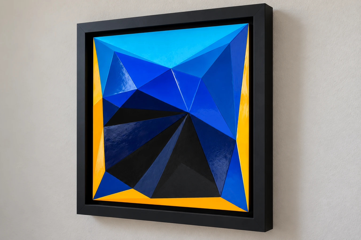 Angled view of Shallow Relief and Saturation showing glossy blue and yellow facets and the recessed black frame